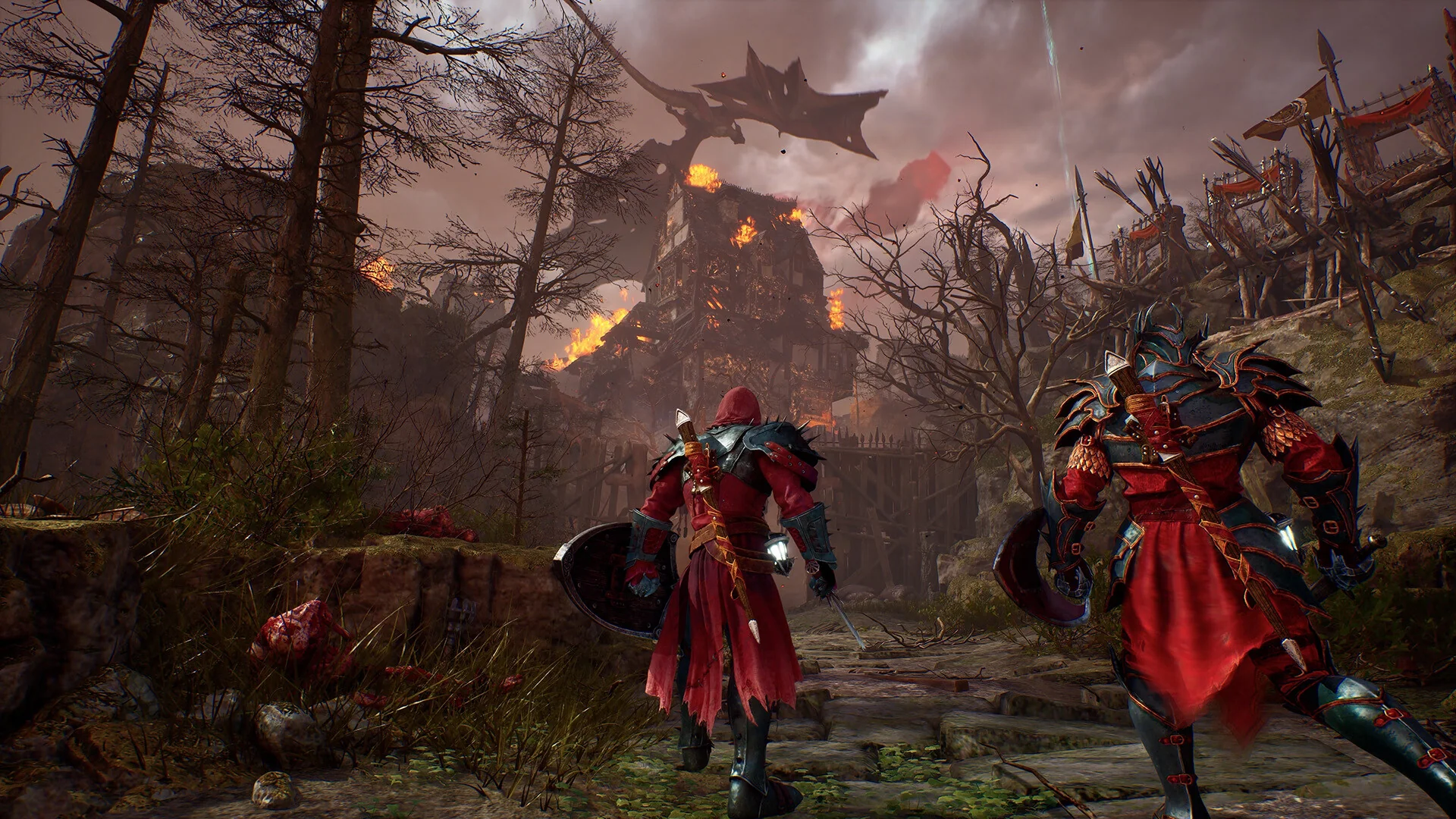 Dois jogadores lado a lado caminham rumo a uma construção em chamas no modo cooperativo de Crimson Moon